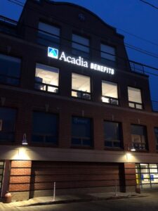 Acadia Benefits Signage at night